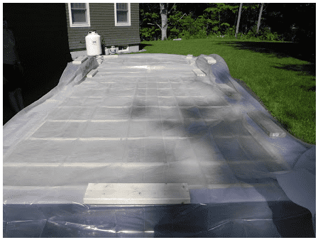 The vapor barrier lays on top of the insulation