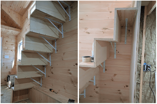 brackets attaching stairs to the tiny house wall
