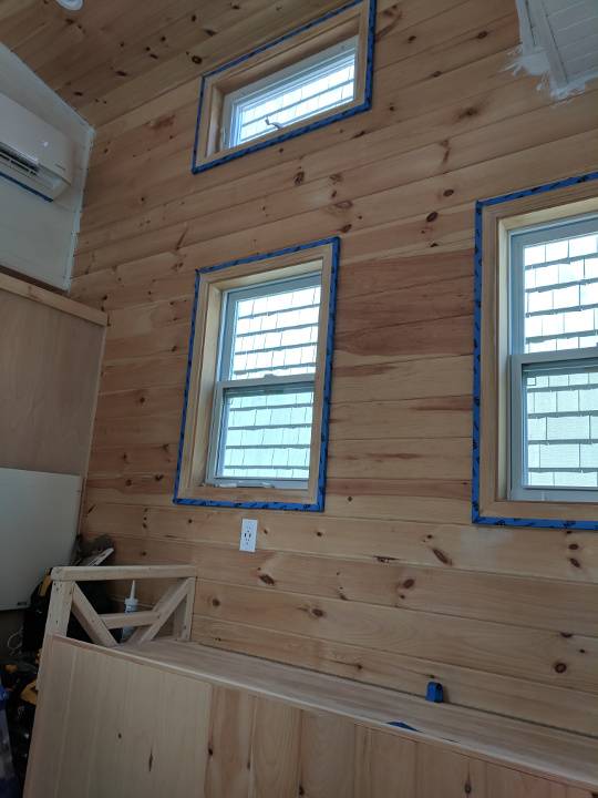 taping around the windows to avoid painting them